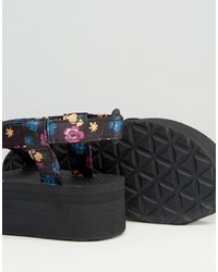 Sandales plates à fleurs noires Teva