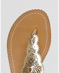 Sandales plates en cuir dorées Dune
