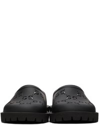 Slippers en caoutchouc noirs Gucci