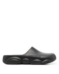 Slippers en caoutchouc noirs Moschino