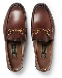 Slippers en cuir marron Gucci