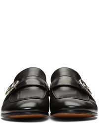 Slippers en cuir noirs Gucci