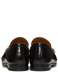 Slippers en cuir noirs Gucci