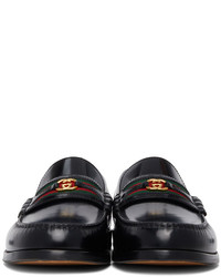 Slippers en cuir noirs Gucci