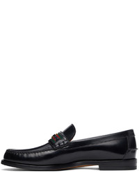 Slippers en cuir noirs Gucci