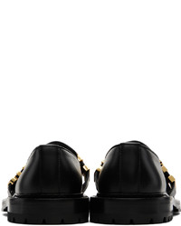 Slippers en cuir noirs Moschino