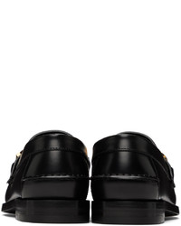 Slippers en cuir noirs Gucci