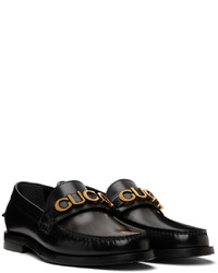 Slippers en cuir noirs Gucci