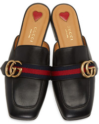 Slippers en cuir noirs Gucci