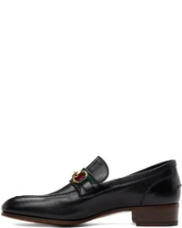 Slippers en cuir noirs Gucci