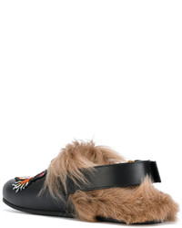 Slippers en cuir noirs Gucci