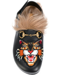 Slippers en cuir noirs Gucci