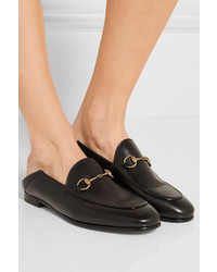 Slippers en cuir noirs Gucci