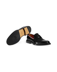 Slippers en cuir noirs Gucci