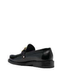 Slippers en cuir noirs Moschino