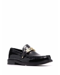 Slippers en cuir noirs Moschino