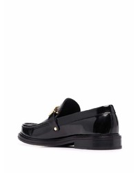 Slippers en cuir noirs Moschino