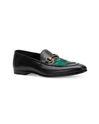 Slippers en cuir noirs Gucci