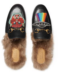 Slippers en cuir noirs Gucci