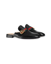 Slippers en cuir noirs Gucci