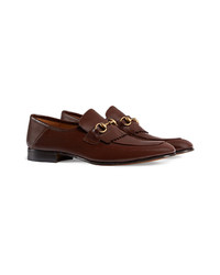 Slippers en cuir ornés marron foncé Gucci