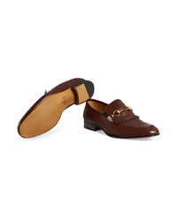 Slippers en cuir ornés marron foncé Gucci