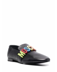 Slippers en cuir ornés noirs Moschino