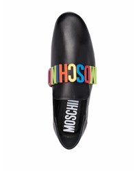 Slippers en cuir ornés noirs Moschino