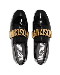 Slippers en cuir ornés noirs Moschino