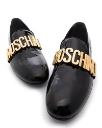 Slippers en cuir ornés noirs Moschino