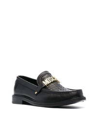 Slippers en cuir ornés noirs Moschino