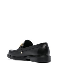 Slippers en cuir ornés noirs Moschino