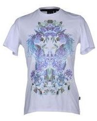 T-shirt à col rond à fleurs blanc et bleu